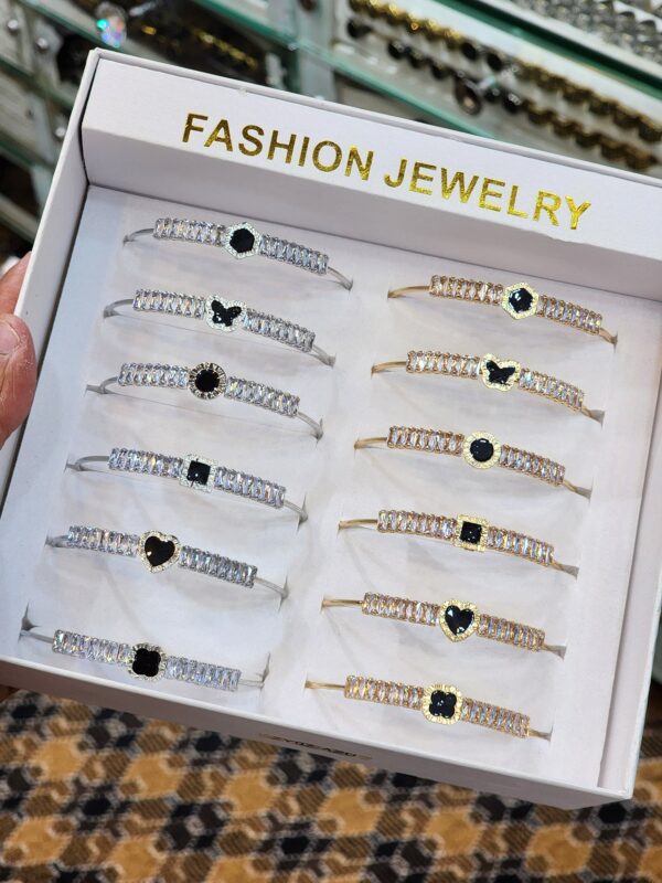 China Gold Handcuff Exclusive By Unique Fancy Jewellery For Women Available in Silver And Golden Colors With Black Stone (1 Pc).