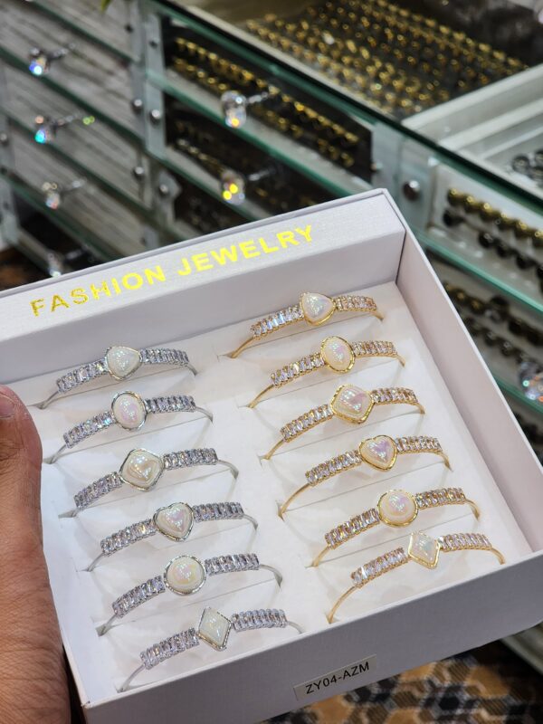 China Gold Handcuff Exclusive By Unique Fancy Jewellery For Women Available in Silver And Golden colors (1 Pc).